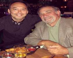 Dan Lauria consuming alcohol